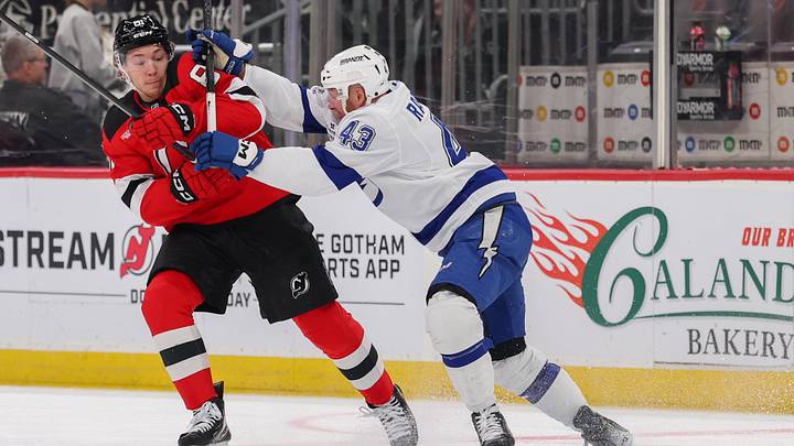 Tampa Bay Lightning defenseman Darren Raddysh (43) hits New Jersey Devils right wing Arseny Gritsyuk (81): Ed Mulholland-Imagn Images