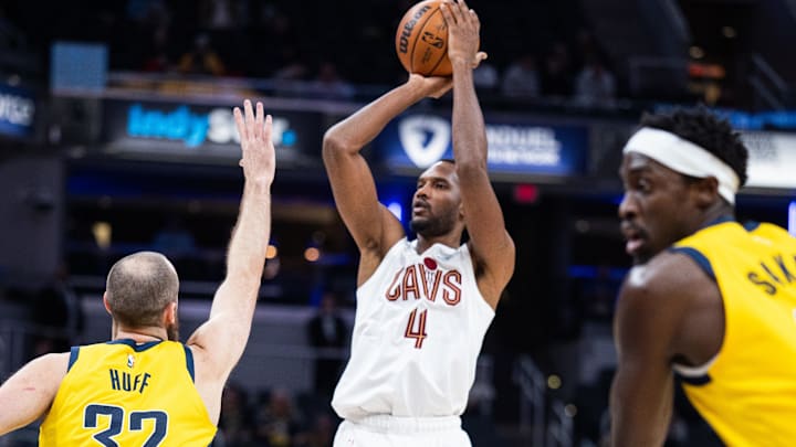 Dec 1, 2025; Indianapolis, Indiana, USA;  Cleveland Cavaliers center Evan Mobley (4) shoots the ball while  Indiana Pacers center Jay Huff (32) defends in the first half at Gainbridge Fieldhouse. Mandatory Credit: Trevor Ruszkowski-Imagn Images