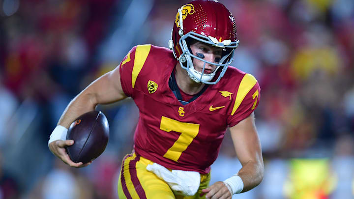 Aug 26, 2023; Los Angeles, California, USA; Southern California Trojans quarterback Miller Moss (7) runs the ball for a touchdown against the San Jose State Spartansduring the second half at Los Angeles Memorial Coliseum. Mandatory Credit: Gary A. Vasquez-Imagn Images