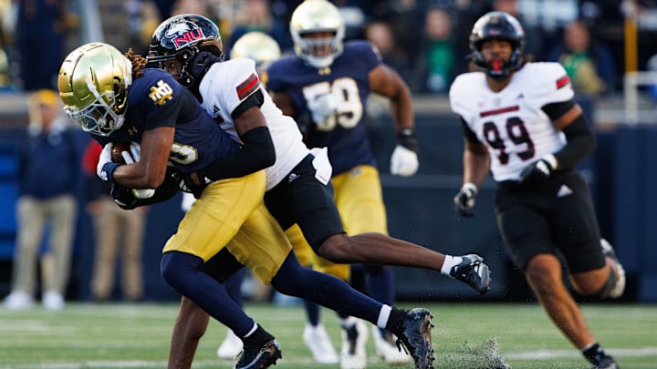 Northern Illinois cornerback Jacob Finley brings down Notre Dame wide receiver Kris Mitchell during their game on Sept. 7.
