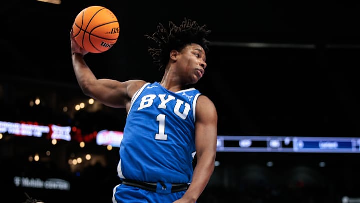Mar 11, 2026; Kansas City, MO, USA; BYU Cougars guard Robert Wright III (1) rebounds during the first half against the West Virginia Mountaineers at T-Mobile Center. Mandatory Credit: William Purnell-Imagn Images