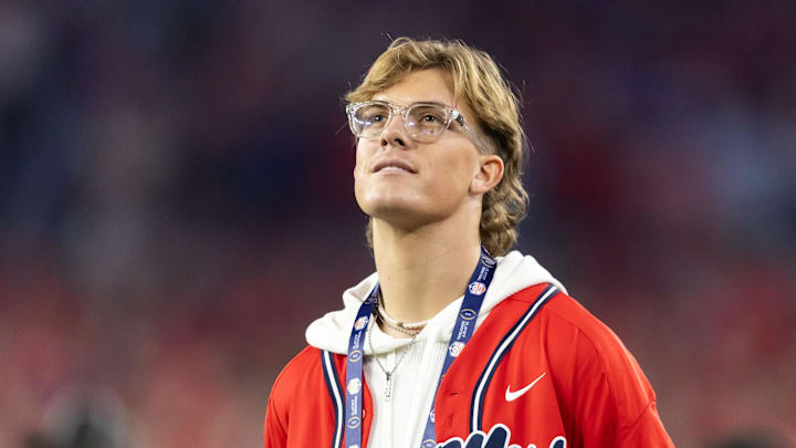 Jan 8, 2026; Glendale, AZ, USA; Mississippi Rebels former quarterback Jaxson Dart in attendance against the Miami Hurricanes during the 2026 Fiesta Bowl and semifinal game of the College Football Playoff at State Farm Stadium. Mandatory Credit: Mark J. Rebilas-Imagn Images Jan 8, 2026; Glendale, AZ, USA; Mississippi Rebels former quarterback Jaxson Dart in attendance against the Miami Hurricanes during the 2026 Fiesta Bowl and semifinal game of the College Football Playoff at State Farm Stadium. Mandatory Credit: Mark J. Rebilas-Imagn Images