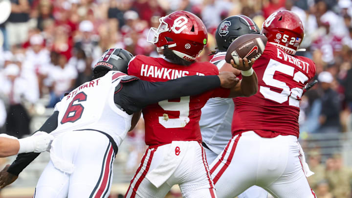 Oct 19, 2024; Norman, Oklahoma, USA; South Carolina Gamecocks edge Dylan Stewart (6) hits Oklahoma Sooners quarterback Michael Hawkins Jr. (9) and causes an interception during the first half at Gaylord Family-Oklahoma Memorial Stadium. Mandatory Credit: Kevin Jairaj-Imagn Images