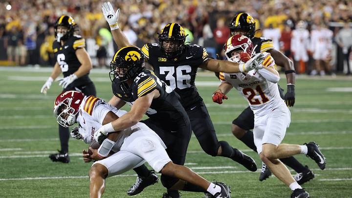 Sep 12, 2026; Iowa City, Iowa, USA; Iowa State Cyclones quarterback Jaylen Raynor (1) is tackled by Iowa Hawkeyes linebacker Cam Buffington (33) during the third quarter at Kinnick Stadium. Mandatory Credit: Reese Strickland-Imagn Images Sep 12, 2026; Iowa City, Iowa, USA; Iowa State Cyclones quarterback Jaylen Raynor (1) is tackled by Iowa Hawkeyes linebacker Cam Buffington (33) during the third quarter at Kinnick Stadium. Mandatory Credit: Reese Strickland-Imagn Images