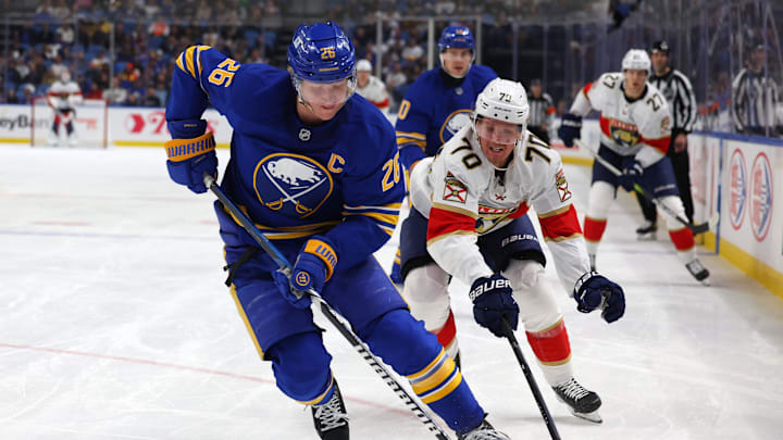 Oct 28, 2024; Buffalo, New York, USA;  Buffalo Sabres defenseman Rasmus Dahlin (26) and Florida Panthers center Jesper Boqvist (70) go after a loose puck during the third period at KeyBank Center. Mandatory Credit: Timothy T. Ludwig-Imagn Images