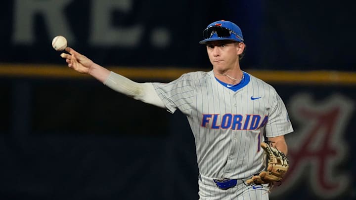May 21, 2025; Hoover, AL, USA; Florida second baseman Justin Nadeau (1) fields and throws to first for an out during the game with Ole Miss in the second round of the SEC Baseball Tournament at the Hoover Met.