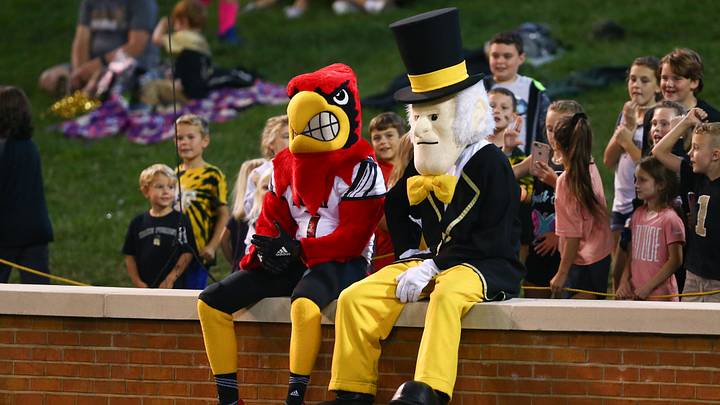 Oct 12, 2019; Winston-Salem, NC, USA; The Louisville Cardinals mascot sits with the Wake Forest Demon Deacons mascot during the third quarter at BB&T Field. Mandatory Credit: Jeremy Brevard-USA TODAY Sports Oct 12, 2019; Winston-Salem, NC, USA; The Louisville Cardinals mascot sits with the Wake Forest Demon Deacons mascot during the third quarter at BB&T Field. Mandatory Credit: Jeremy Brevard-USA TODAY Sports