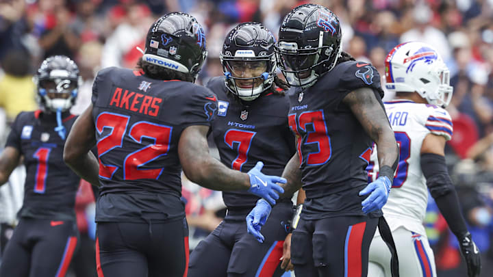 Houston Texans quarterback C.J. Stroud celebrates with running back Cam Akers