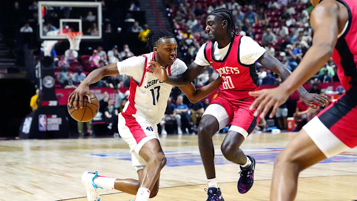 Jul 14, 2024; Las Vegas, NV, USA; Washington Wizards guard Bub Carrington (17) dribbles against Houston Rockets guard Kira Lewis Jr (60) during the first quarter at Thomas & Mack Center. Mandatory Credit: Stephen R. Sylvanie-Imagn Images Jul 14, 2024; Las Vegas, NV, USA; Washington Wizards guard Bub Carrington (17) dribbles against Houston Rockets guard Kira Lewis Jr (60) during the first quarter at Thomas & Mack Center. Mandatory Credit: Stephen R. Sylvanie-Imagn Images
