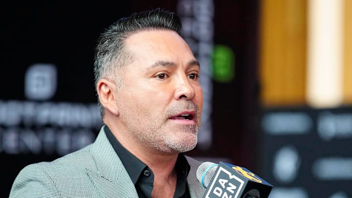 Oscar De La Hoya speaks about boxer Jamie Munguia (center) about the Munguia v Ryder main event during a press conference for Golden Boy boxing event on Jan. 25, 2024.