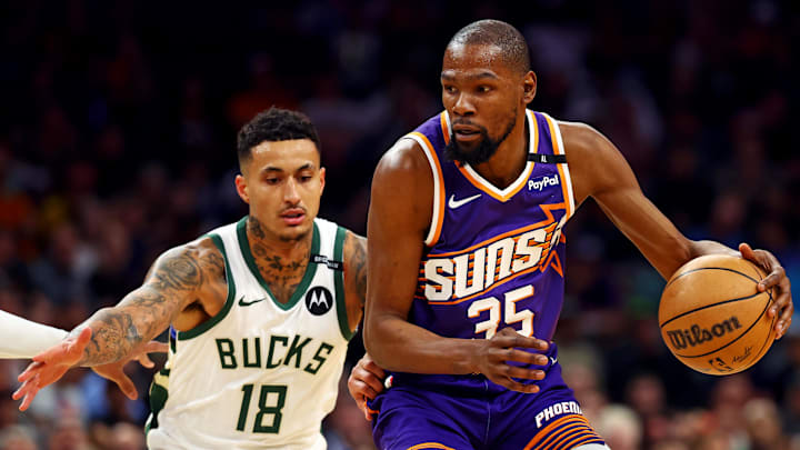 Mar 24, 2025; Phoenix, Arizona, USA; Phoenix Suns forward Kevin Durant (35) handles the ball against Milwaukee Bucks forward Kyle Kuzma (18) during the first quarter at Footprint Center. Mandatory Credit: Mark J. Rebilas-Imagn Images Mar 24, 2025; Phoenix, Arizona, USA; Phoenix Suns forward Kevin Durant (35) handles the ball against Milwaukee Bucks forward Kyle Kuzma (18) during the first quarter at Footprint Center. Mandatory Credit: Mark J. Rebilas-Imagn Images