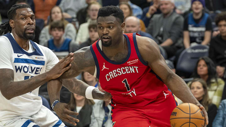 Mar 19, 2025; Minneapolis, Minnesota, USA; New Orleans Pelicans forward Zion Williamson (1) drives to the basket past Minnesota Timberwolves center Naz Reid (11) in the second half at Target Center. Mandatory Credit: Jesse Johnson-Imagn Images