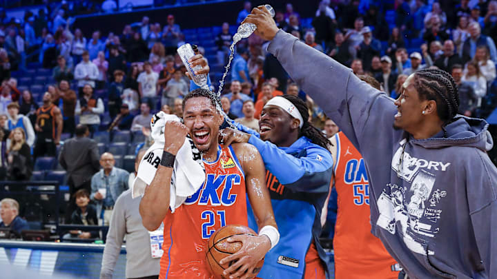 Feb 1, 2025; Oklahoma City, Oklahoma, USA; Oklahoma City Thunder guard Aaron Wiggins (21) gets water poured on him by his teammates after his performance against the Sacramento Kings during the second half at Paycom Center. Mandatory Credit: Alonzo Adams-Imagn Images Feb 1, 2025; Oklahoma City, Oklahoma, USA; Oklahoma City Thunder guard Aaron Wiggins (21) gets water poured on him by his teammates after his performance against the Sacramento Kings during the second half at Paycom Center. Mandatory Credit: Alonzo Adams-Imagn Images
