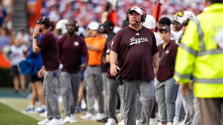Sep 14, 2024; Gainesville, Florida, USA; Texas A&M Aggies head coach Mike Elko walks the sideline against the Florida Gators during the first half at Ben Hill Griffin Stadium. 
