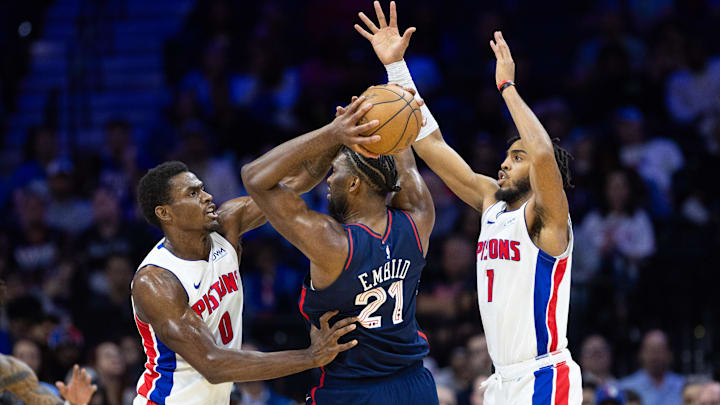 Apr 9, 2024; Philadelphia, Pennsylvania, USA; Philadelphia 76ers center Joel Embiid (21) controls the ball against Detroit Pistons center Jalen Duren (0): Bill Streicher-Imagn Images
