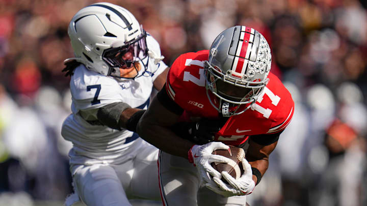 Ohio State Buckeyes wide receiver Carnell Tate (17) catches a touchdown pass while being defended by Penn State Nittany Lions cornerback Zion Tracy (7) during the NCAA football game at Ohio Stadium in Columbus on Nov. 1, 2025.