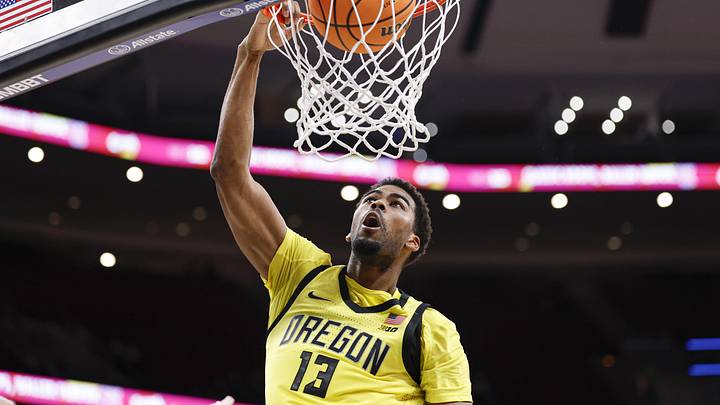 Mar 10, 2026; Chicago, IL, USA; Oregon Ducks forward Sean Stewart (13) scores against the Maryland Terrapins during the second half at United Center. Mandatory Credit: Kamil Krzaczynski-Imagn Images