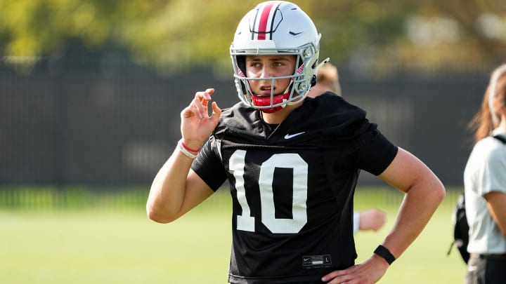 Aug 1, 2024; Columbus, OH, USA; Ohio State Buckeyes quarterback Julian Sayin (10) motions during football camp at the Woody Hayes Athletic Complex.