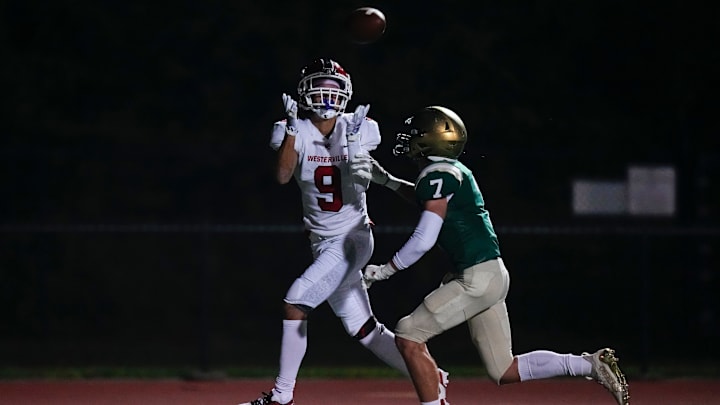 Aug 18, 2023; Dublin, Ohio, USA; Westerville South Wildcats DB/WR Isaac Patterson (9) catches a touchdown pass over Dublin Jerome Celtics defensive back Nick Hughes (7) during the second half of the high school football game at Dublin Jerome High School. Jerome won 30-15.