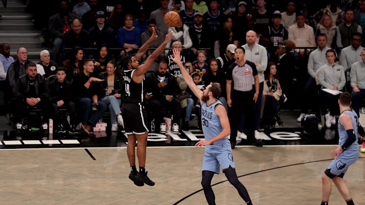 Nov 4, 2024; Brooklyn, New York, USA; Brooklyn Nets guard Cam Thomas (24) shoots a three point shot against Memphis Grizzlies center Jay Huff (30) during the second quarter at Barclays Center. Mandatory Credit: Brad Penner-Imagn Images Nov 4, 2024; Brooklyn, New York, USA; Brooklyn Nets guard Cam Thomas (24) shoots a three point shot against Memphis Grizzlies center Jay Huff (30) during the second quarter at Barclays Center. Mandatory Credit: Brad Penner-Imagn Images