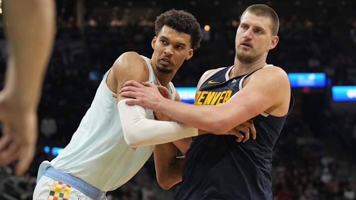 Jan 4, 2025; San Antonio, Texas, USA; San Antonio Spurs center Victor Wembanyama (1) and Denver Nuggets center Nikola Jokic (15) battle for position during an inbound pass in the second half at Frost Bank Center. Mandatory Credit: Scott Wachter-Imagn Images
