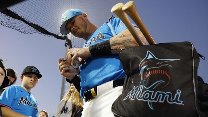 Miami Marlins right fielder Kemp Alderman (41) signs autographs for fans before the game. 