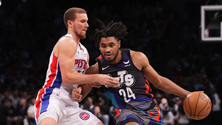 Apr 6, 2024; Brooklyn, New York, USA; Brooklyn Nets shooting guard Cam Thomas (24) drives the ball against Detroit Pistons point guard Malachi Flynn (14) during the second half at Barclays Center. Mandatory Credit: Gregory Fisher-Imagn Images