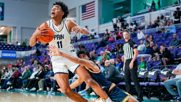 Principia Panthers guard Quentin Coleman (11) is fouled by Wheeler Wildcats guard Kevin Savage III (2) during the fourth quarter of a City of Palms Classic quarterfinal game at Suncoast Credit Union Arena in Fort Myers, Fla., on Saturday, Dec. 20, 2025.