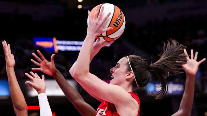 Indiana Fever guard Caitlin Clark (22) goes up for a shot Sunday, Sept. 8, 2024, during a game between the Indiana Fever and the Atlanta Dream at Gainbridge Fieldhouse in Indianapolis. The Fever defeated the Dream in overtime, 104-100. Indiana Fever guard Caitlin Clark (22) goes up for a shot Sunday, Sept. 8, 2024, during a game between the Indiana Fever and the Atlanta Dream at Gainbridge Fieldhouse in Indianapolis. The Fever defeated the Dream in overtime, 104-100.