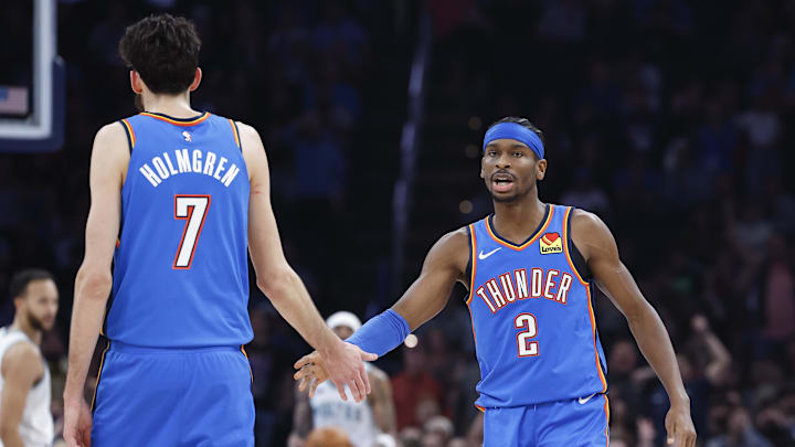Jan 29, 2024; Oklahoma City, Oklahoma, USA; Oklahoma City Thunder guard Shai Gilgeous-Alexander (2) and Oklahoma City Thunder forward Chet Holmgren (7) celebrate after a play against the Minnesota Timberwolves during the second quarter at Paycom Center. Mandatory Credit: Alonzo Adams-Imagn Images