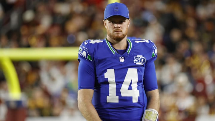 Nov 2, 2025; Landover, Maryland, USA; Seattle Seahawks quarterback Sam Darnold (14) looks on during the first half against the Washington Commanders at Northwest Stadium. Mandatory Credit: Amber Searls-Imagn Images