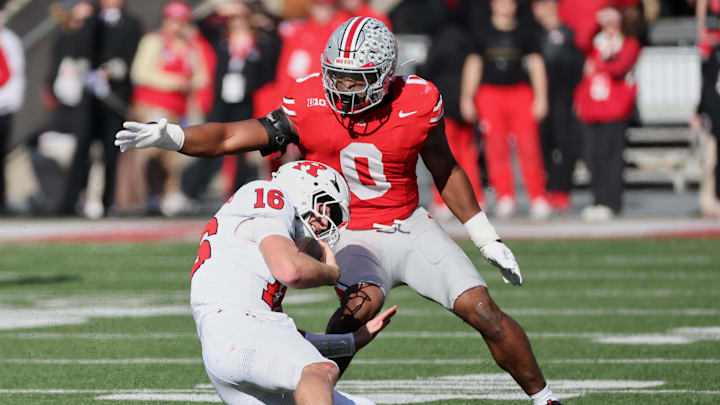 Nov 22, 2025; Columbus, Ohio, USA; Ohio State Buckeyes linebacker Sonny Styles (0) tackles Rutgers Scarlet Knights quarterback Athan Kaliakmanis (16) during the first quarter at Ohio Stadium. Mandatory Credit: Joseph Maiorana-Imagn Images
