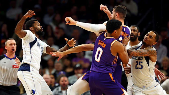 Dallas Mavericks forward Marshall punches Phoenix Suns center Nurkic during the third quarter at Footprint Center.