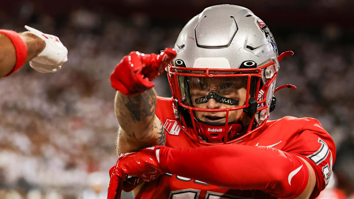 Aug 31, 2024; Tucson, Arizona, USA; New Mexico wide receiver Luke Wysong (15) celebrates touchdown during first quarter at Arizona Stadium. Mandatory Credit: Aryanna Frank-Imagn Images