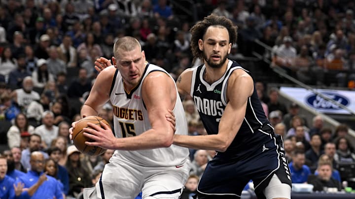 Jan 12, 2025; Dallas, Texas, USA; Denver Nuggets center Nikola Jokic (15) grabs a rebound in front of Dallas Mavericks center Dereck Lively II (2) during the second quarter at the American Airlines Center. Mandatory Credit: Jerome Miron-Imagn Images Jan 12, 2025; Dallas, Texas, USA; Denver Nuggets center Nikola Jokic (15) grabs a rebound in front of Dallas Mavericks center Dereck Lively II (2) during the second quarter at the American Airlines Center. Mandatory Credit: Jerome Miron-Imagn Images