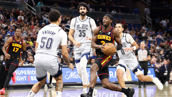 Caris LeVert #3 of the Atlanta Hawks drives to the basket against the Orlando Magic.