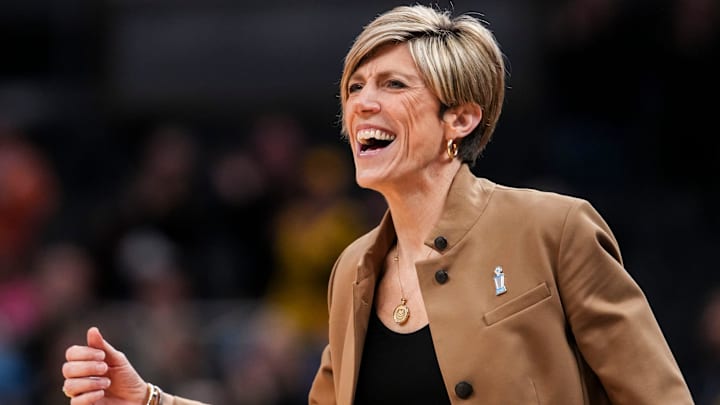 Iowa Hawkeyes head coach Jan Jensen celebrates Saturday, March 7, 2026, during a Big Ten women's basketball tournament semifinals game at Gainbridge Fieldhouse in Indianapolis. The Iowa Hawkeyes defeated the Michigan Wolverines, 59-42.