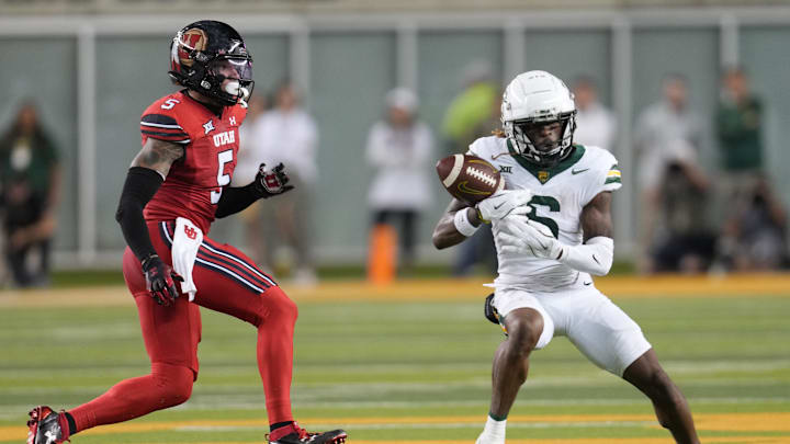 Nov 15, 2025; Waco, Texas, USA;  Baylor Bears wide receiver Ashtyn Hawkins (6) makes a catch against Utah Utes safety Tao Johnson (5) during the second half at McLane Stadium. Mandatory Credit: Chris Jones-Imagn Images