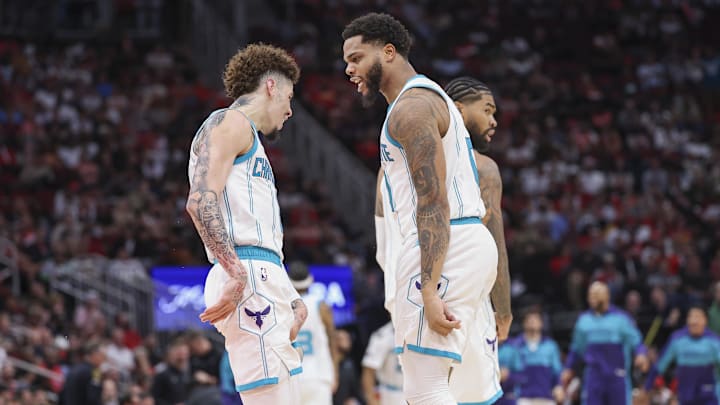 Charlotte Hornets forward Miles Bridges (0) celebrates with guard LaMelo Ball (1) after scoring a basket during the fourth quarter against the Houston Rockets at Toyota Center. Charlotte Hornets forward Miles Bridges (0) celebrates with guard LaMelo Ball (1) after scoring a basket during the fourth quarter against the Houston Rockets at Toyota Center.