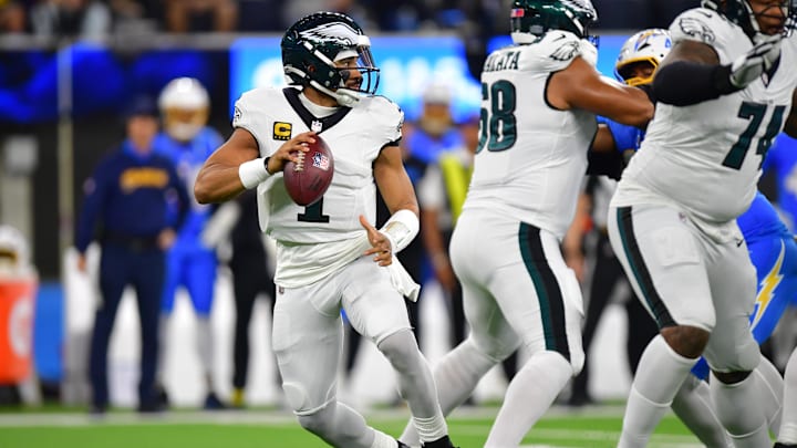Dec 8, 2025; Inglewood, California, USA; Philadelphia Eagles quarterback Jalen Hurts (1) looks to pass against the Los Angeles Chargers in the first half at SoFi Stadium. Mandatory Credit: Gary A. Vasquez-Imagn Images