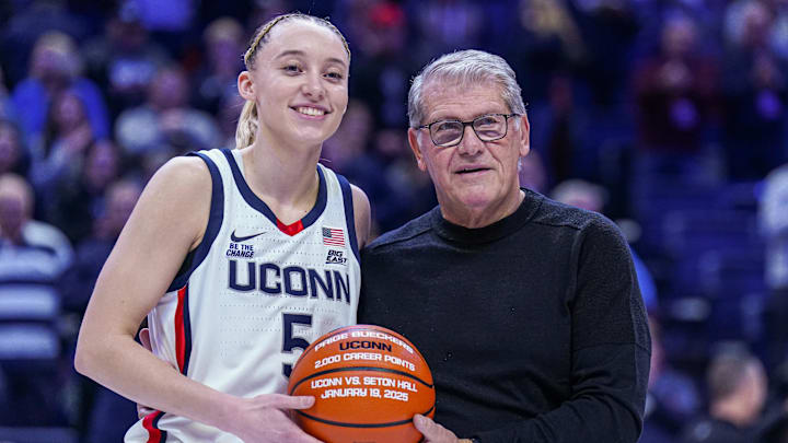 Jan 22, 2025; Storrs, Connecticut, USA; UConn Huskies guard Paige Bueckers (5) is recognized with head coach Geno Auriemma for her 2000 career points before the start of the game against the Villanova Wildcats at Harry A. Gampel Pavilion. Mandatory Credit: David Butler II-Imagn Images Jan 22, 2025; Storrs, Connecticut, USA; UConn Huskies guard Paige Bueckers (5) is recognized with head coach Geno Auriemma for her 2000 career points before the start of the game against the Villanova Wildcats at Harry A. Gampel Pavilion. Mandatory Credit: David Butler II-Imagn Images