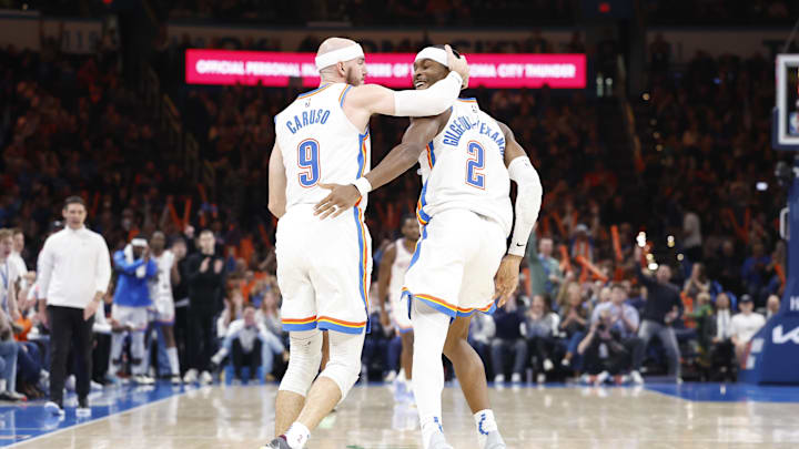 Dec 23, 2024; Oklahoma City, Oklahoma, USA; Oklahoma City Thunder guard Alex Caruso (9) and guard Shai Gilgeous-Alexander (2) celebrate after a play against the Washington Wizards during the second half at Paycom Center. Mandatory Credit: Alonzo Adams-Imagn Images