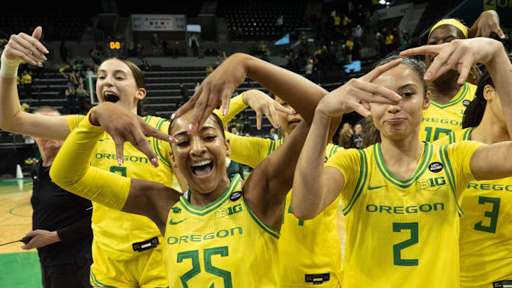Oregon’s Elisa Mevius, left, Deja Kelly and Katie Fiso celebrate with teammates after defeating Washington at Matthew Knight Arena Wednesday, Feb. 12, 2025. Oregon’s Elisa Mevius, left, Deja Kelly and Katie Fiso celebrate with teammates after defeating Washington at Matthew Knight Arena Wednesday, Feb. 12, 2025.