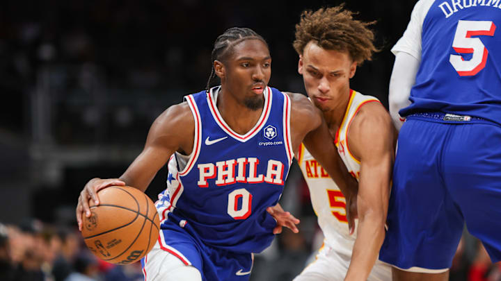 Oct 14, 2024; Atlanta, Georgia, USA; Philadelphia 76ers guard Tyrese Maxey (0) drives on Atlanta Hawks guard Dyson Daniels (5) in the first quarter at State Farm Arena. Mandatory Credit: Brett Davis-Imagn Images