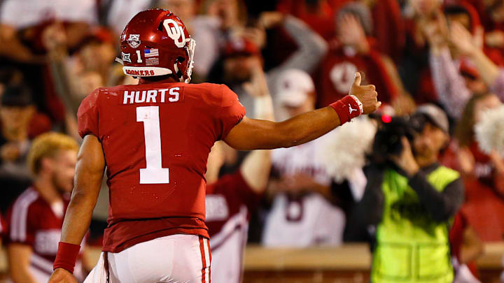Quarterback Jalen Hurts #1 of the Oklahoma Sooners celebrates his touchdown against the Iowa State Cyclones in the second quarter on November 9, 2019 at Gaylord Family Oklahoma Memorial Stadium in Norman, Oklahoma. OU held on to win 42-41.