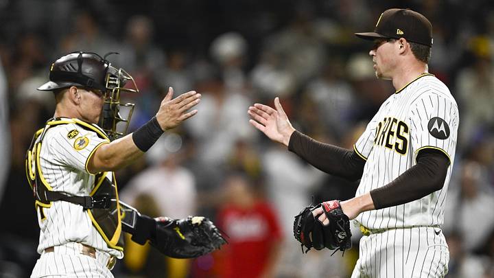 Jun 8, 2026; San Diego, California, USA; San Diego Padres pitcher Mason Miller (22) is congratulated by catcher Freddy Fermin (54) after the San Diego Padres beat the Cincinnati Reds at Petco Park. Mandatory Credit: Denis Poroy-Imagn Images