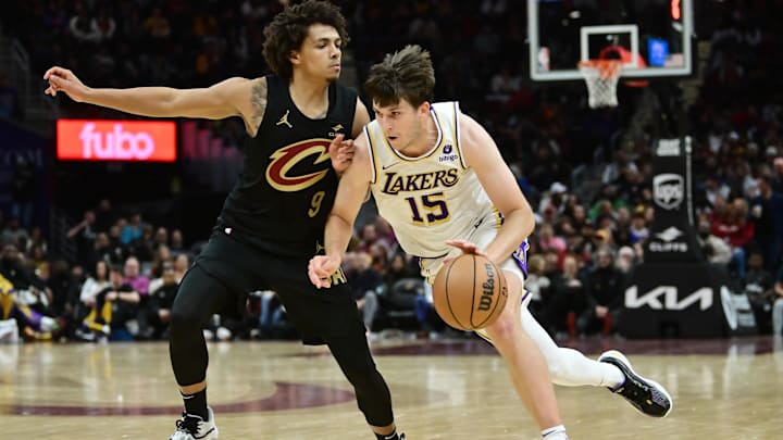 Nov 25, 2023; Cleveland, Ohio, USA; Los Angeles Lakers guard Austin Reaves (15) drives to the basket against Cleveland Cavaliers guard Craig Porter (9) during the second half at Rocket Mortgage FieldHouse. Mandatory Credit: Ken Blaze-Imagn Images