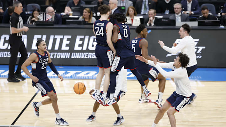 Mar 29, 2026; Washington, DC, USA; UConn Huskies guard Malachi Smith (0) celebrates with UConn Huskies guard Braylon Mullins (24) after defeating the Duke Blue Devils in an Elite Eight game of the East Regional of the men's 2026 NCAA Tournament at Capital One Arena. Mandatory Credit: Amber Searls-Imagn Images