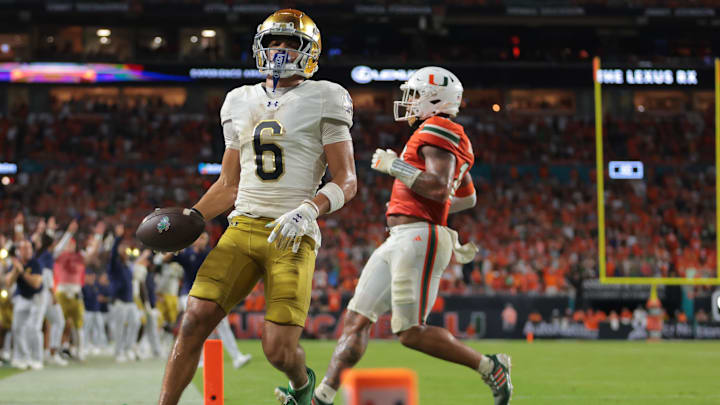 Aug 31, 2025; Miami Gardens, Florida, USA; Notre Dame Fighting Irish wide receiver Jordan Faison (6) scores a touchdown against the Miami Hurricanes during the third quarter at Hard Rock Stadium. Mandatory Credit: Sam Navarro-Imagn Images