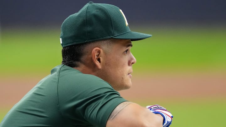 Apr 18, 2025; Milwaukee, Wisconsin, USA;  Athletics third baseman Gio Urshela (13) looks on during batting practice prior to the game against the Milwaukee Brewers at American Family Field. Mandatory Credit: Jeff Hanisch-Imagn Images